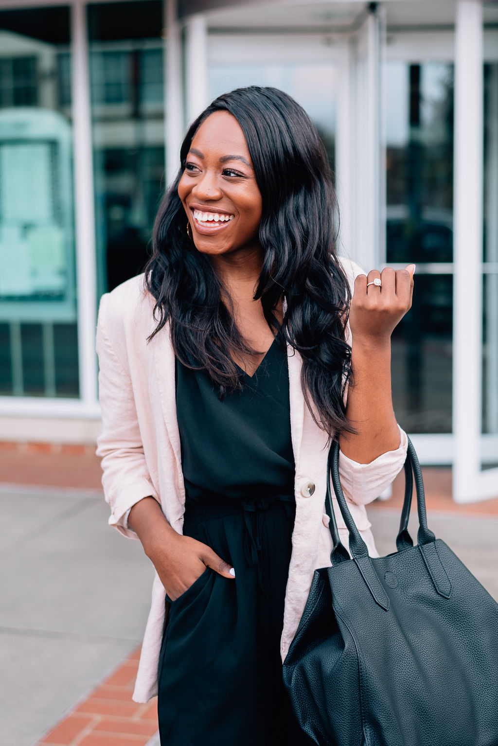 Southern fashion blogger, Tomi from GoodTomiCha, shares her business casual outfit for work. | Pink linen blazer and black jumpsuit | spring workwear