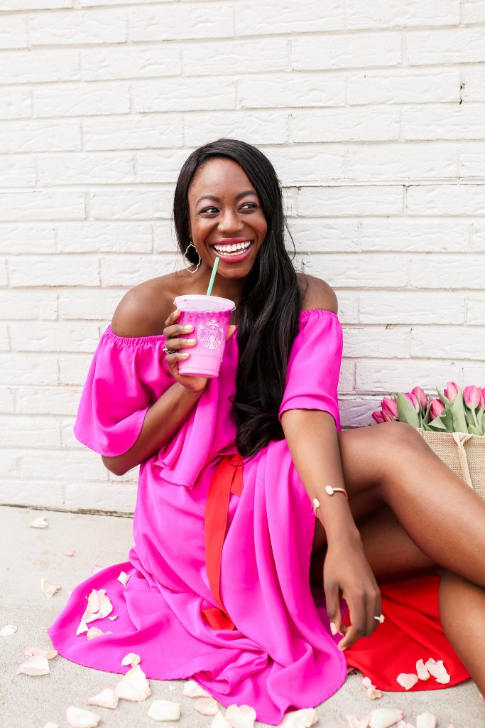 woman wearing pink dress and sharing Top Blog Posts in 2019