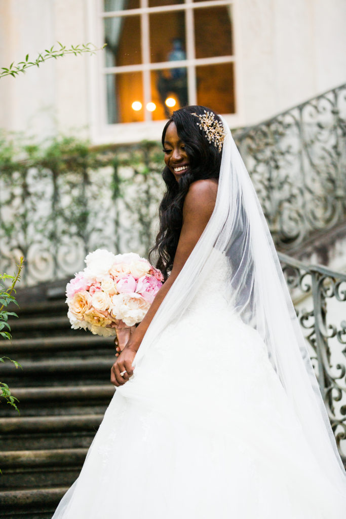 Top Charlotte blogger, Tomi Obebe (@goodtomicha) on her wedding day, long, cathedral veil, | Full wedding details on GoodTomiCha.com