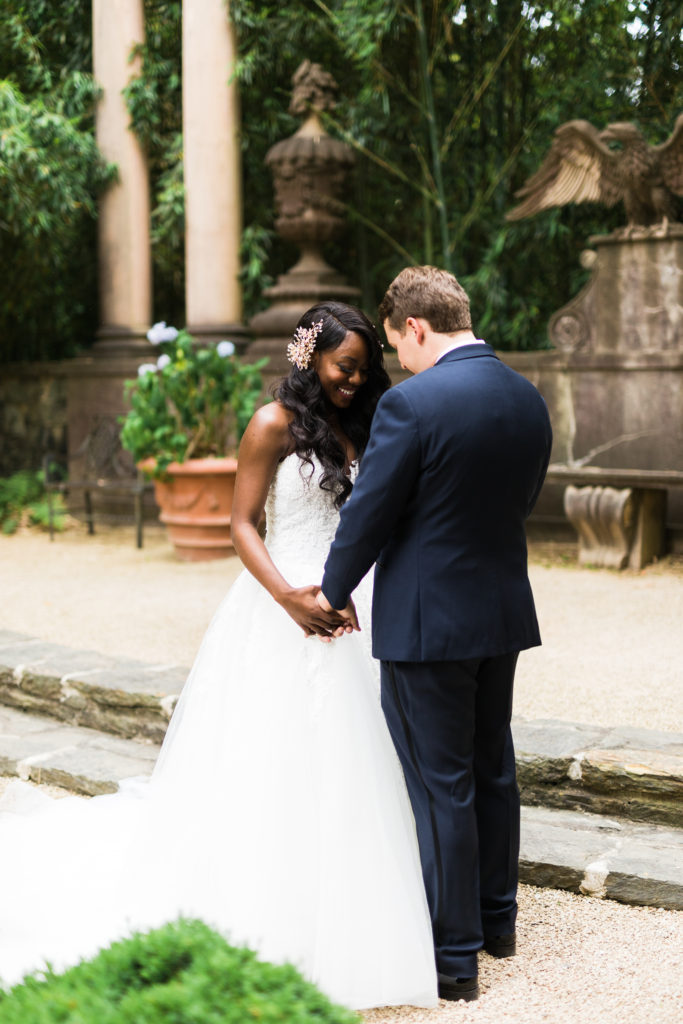 First look by interracial couple before their wedding ceremony