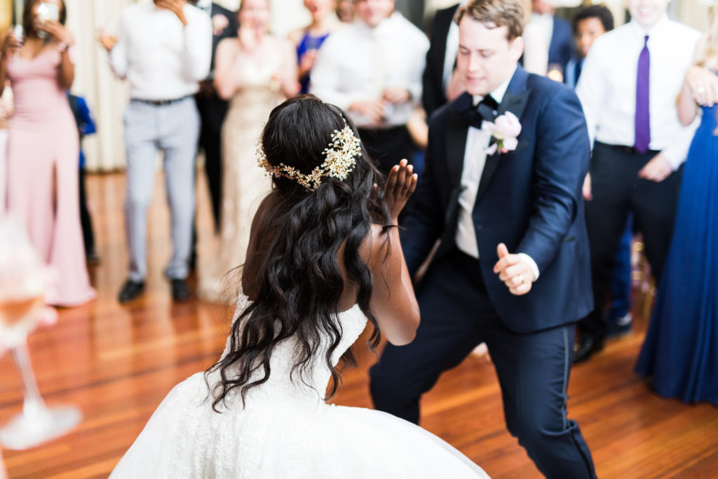 Top black fashion blogger @goodtomicha dancing with her husband on their wedding day