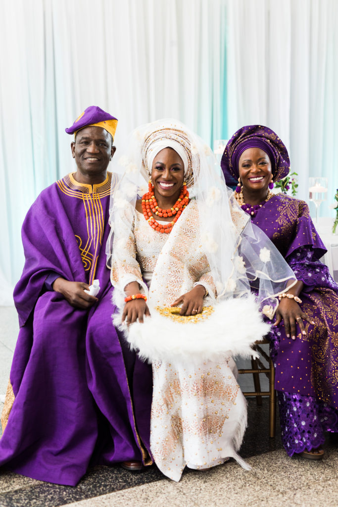 Nigerian bride, Tomi Obebe, posing with her parents during the engagement ceremony