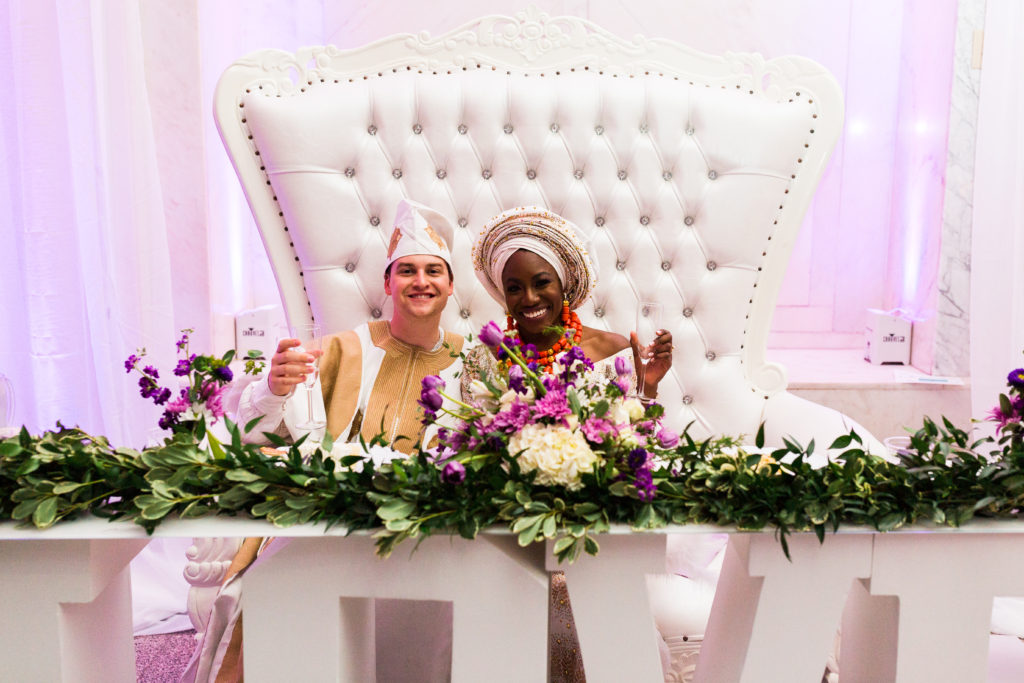 custom-designed sweetheart table with LOVE and giant royal chair for the couple