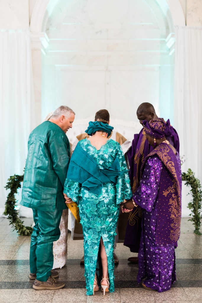 Family prayer from both the groom and bride's parents at a traditional Yoruba ceremony