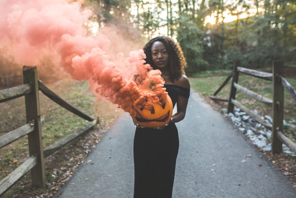 Orange smoke bomb pumpkin photography | Top black fashion blogger GoodTomiCha shares her tips on how to get the perfect spooky shot
