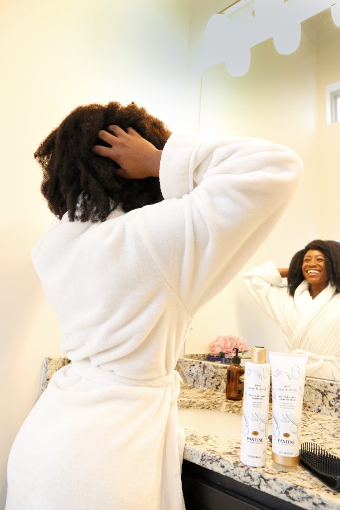 woman holding and sharing winter hair care with Pantene 