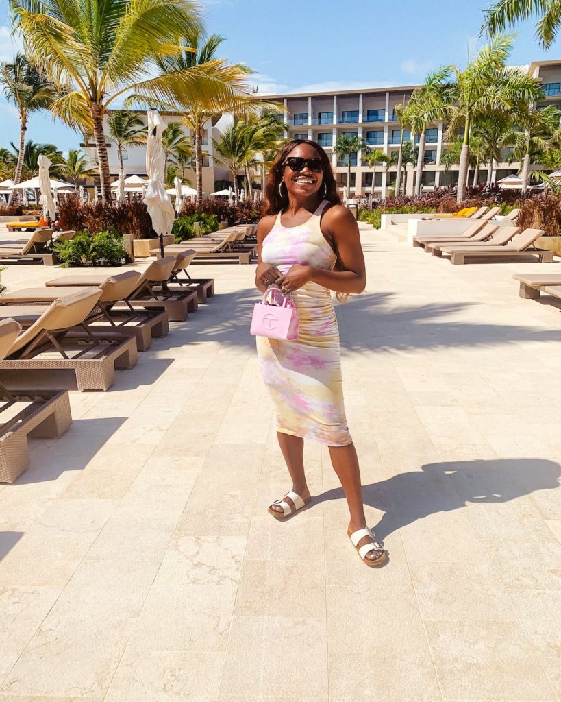 woman wearing cotton candy dress in a resort for dr outfit roundup