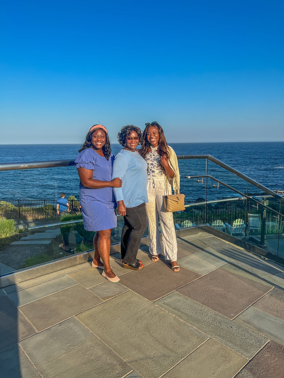 three women posing by stairs in Maine