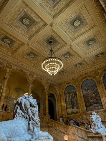 The famous lions inside of the gorgeous Boston Public Library | Free things to do in Boston on GoodTomiCha.com