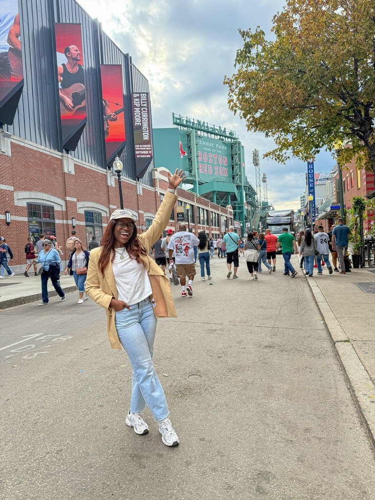 Top lifestyle content creator Tomi Obebe posing outside of Fenway Park | 24 Hours in Boston Itinerary on GoodTomiCha.com